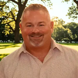 owner of Free Rein Solar Brad Lyle in a sunlit park